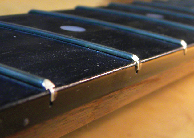 FRET SPROUTING WHERE FRET ENDS PROTRUDE FROM A DRIED-OUT FRETBOARD image from Premier Guitar
