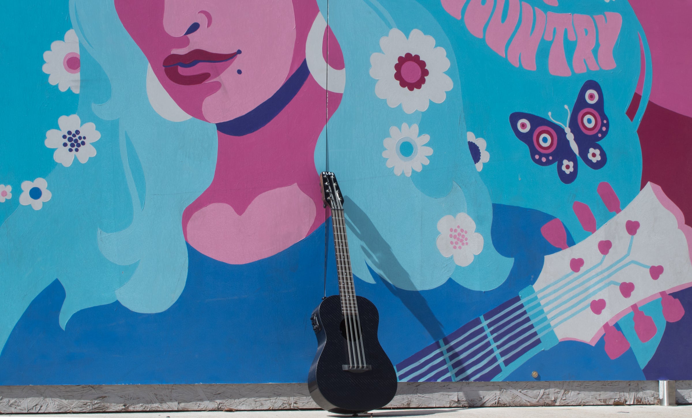 8-String Uke and Dolly Parton Mural